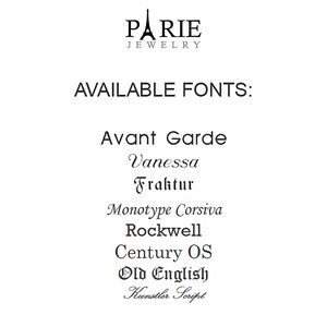 May include: A list of available fonts for jewelry personalization: Avant Garde, Vanessa, Fraktur, Monotype Corsiva, Rockwell, Century OS, Old English, and Kunstler Script.