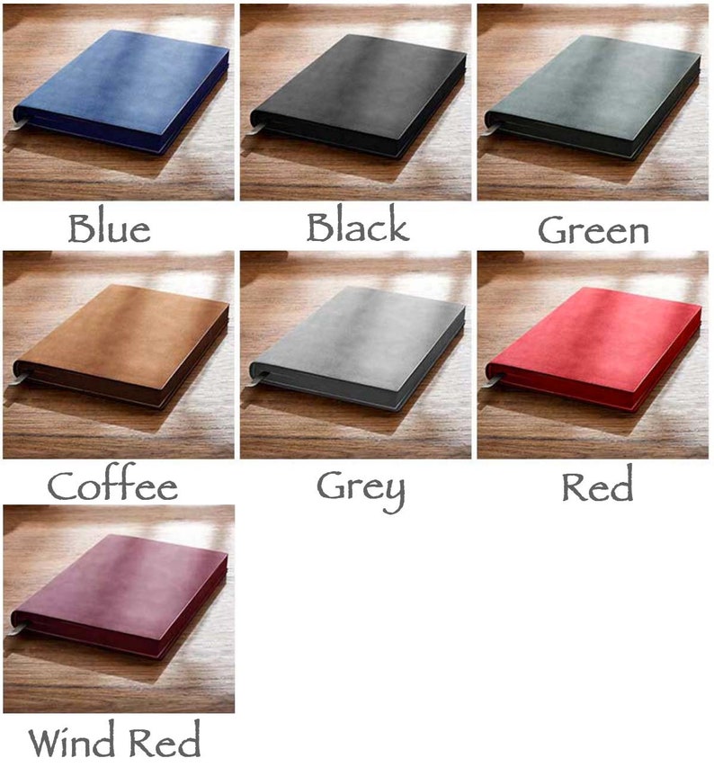 May include: A set of six notebooks in various colors, including blue, black, green, coffee, grey, red, and wind red. The notebooks are all closed and have a soft, textured cover.