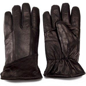 May include: A pair of black leather gloves with a ribbed cuff. The gloves have a simple design and are made of a soft, supple leather.