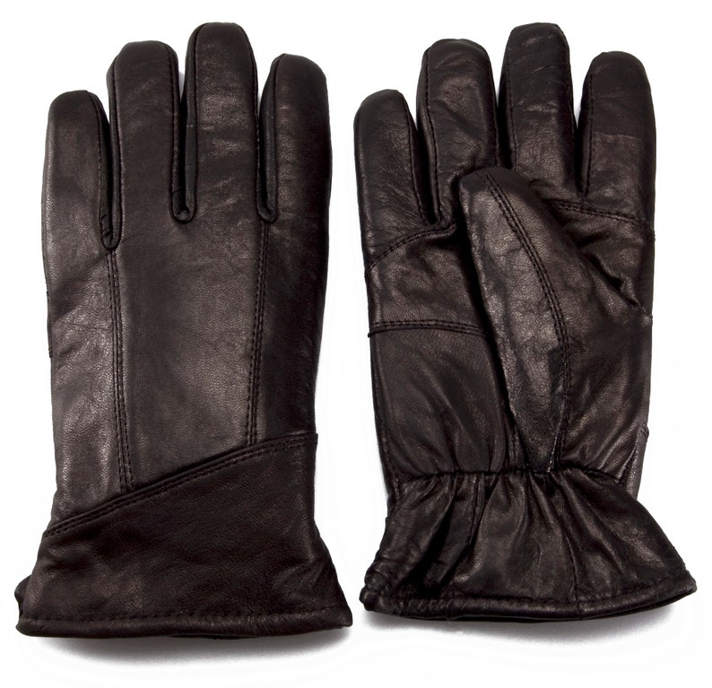 May include: A pair of black leather gloves with a ribbed cuff. The gloves have a simple design and are made of a soft, supple leather.