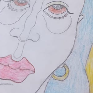 May include: A pencil drawing of a face, featuring red eyes, full red lips, and blue hair. The artwork is a close-up, focusing on the facial features. A gold and blue earring is visible. The style is illustrative.