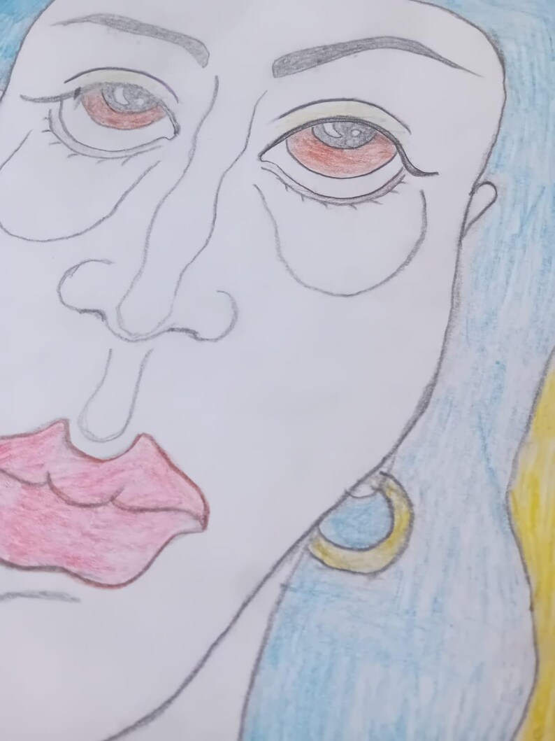 May include: A pencil drawing of a face, featuring red eyes, full red lips, and blue hair. The artwork is a close-up, focusing on the facial features. A gold and blue earring is visible. The style is illustrative.