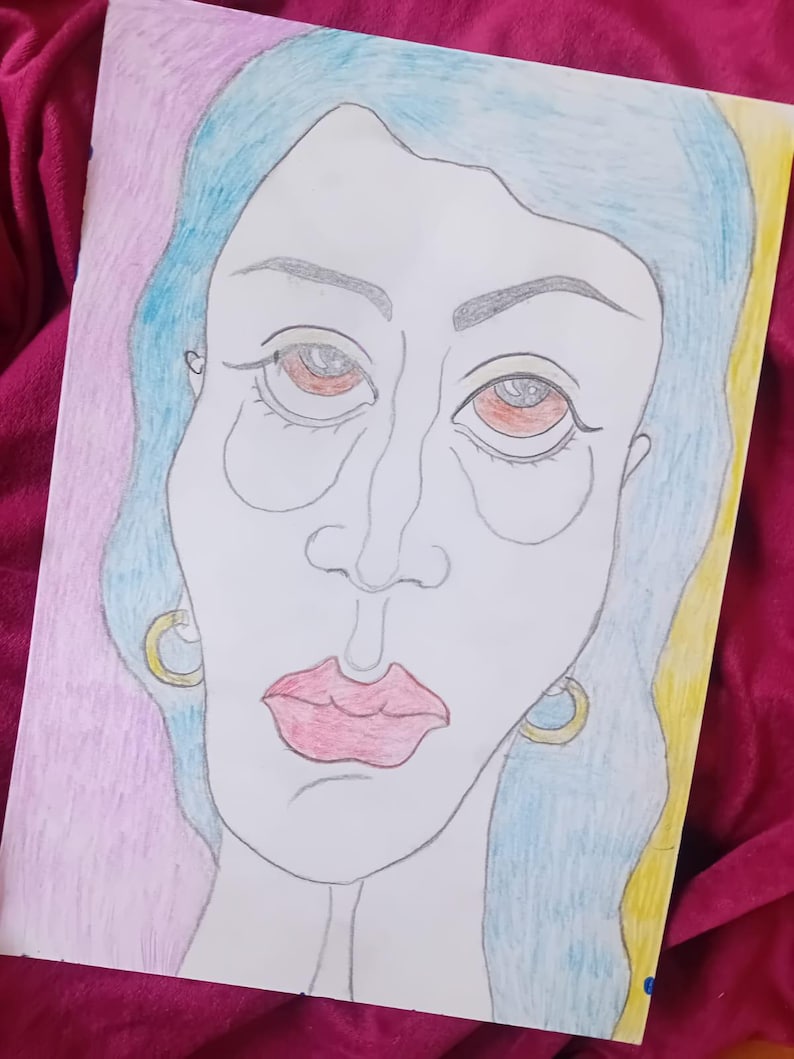 May include: A colored pencil drawing of a woman's face. The woman has blue hair, red lips, and gold hoop earrings. The background is pink and yellow.