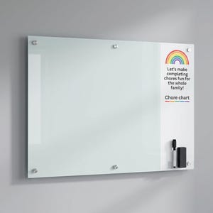May include: A rectangular glass dry-erase board with silver mounting hardware. The right side features a rainbow graphic and the text: Let's make completing chores fun for the whole family! Chore chart. Includes a black marker and eraser.