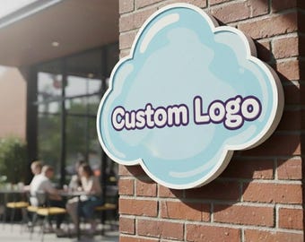 May include: A cloud-shaped wall sign mounted on a red brick exterior. The sign features a light blue background with a white border and the text "Custom Logo" written in a bold, dark purple, rounded font with a white outline.
