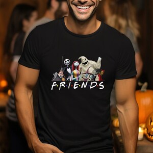 May include: Black t-shirt featuring a graphic of characters from the Nightmare Before Christmas film. The characters are arranged in a line with the text "FRIENDS" below them.