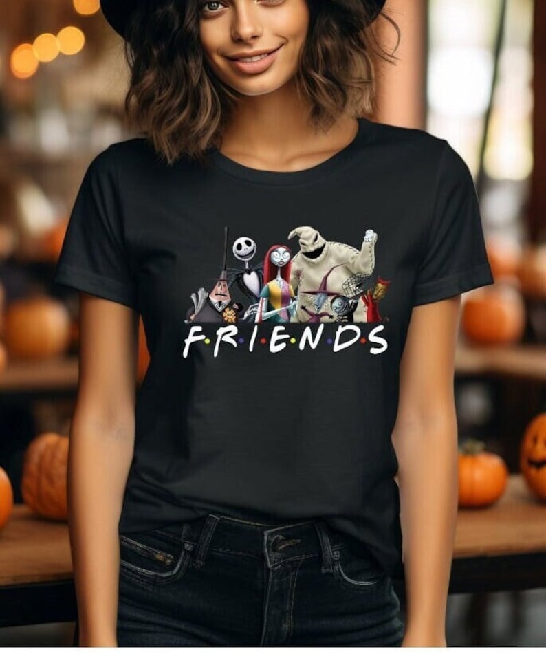 May include: Black t-shirt featuring a graphic print of characters from the film "The Nightmare Before Christmas" with the word "FRIENDS" underneath.