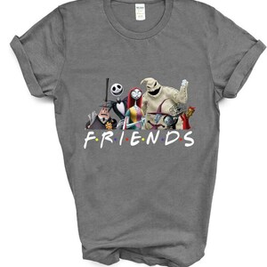 May include: A grey t-shirt featuring a graphic of characters from the film "The Nightmare Before Christmas" and the word "FRIENDS" written below the characters. The characters are arranged in a line and include Jack Skellington, Sally, Oogie Boogie, and others.