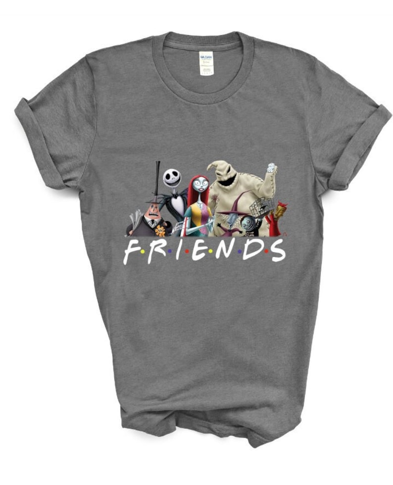 May include: A grey t-shirt featuring a graphic of characters from the film "The Nightmare Before Christmas" and the word "FRIENDS" written below the characters. The characters are arranged in a line and include Jack Skellington, Sally, Oogie Boogie, and others.