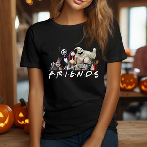 May include: Black t-shirt featuring a graphic of characters from the Nightmare Before Christmas film. The characters are arranged in a line with the text "FRIENDS" underneath.
