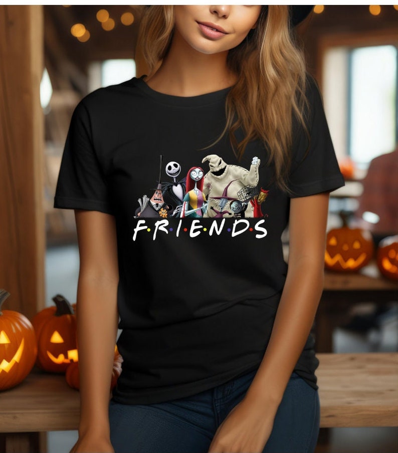 May include: Black t-shirt featuring a graphic of characters from the Nightmare Before Christmas film. The characters are arranged in a line with the text "FRIENDS" underneath.