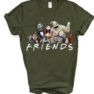 May include: A green t-shirt featuring a graphic print of characters from the film "The Nightmare Before Christmas" with the text "FRIENDS" underneath.