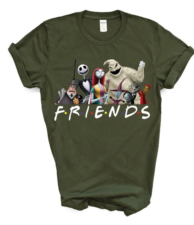 May include: A green t-shirt featuring a graphic print of characters from the film "The Nightmare Before Christmas" with the text "FRIENDS" underneath.