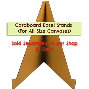 May include: A brown cardboard easel stand for displaying canvases of various sizes. The stand is folded into a triangular shape and has a small lip on each side to hold the canvas in place. The text "Cardboard Easel Stands (For All Size Canvases)" and "Sold Separately in our Shop $4 Each" is printed on the stand.
