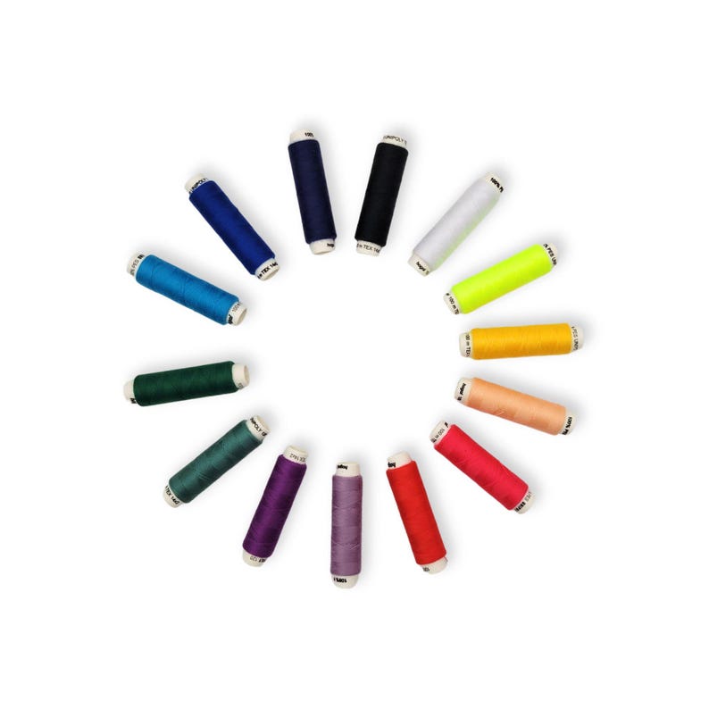 May include: A circle of spools of thread in various colors, including red, orange, yellow, green, blue, purple, and white.