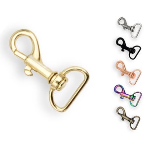 Könnte beinhalten: Ein Satz von sechs Metall-Drehverschlüssen in verschiedenen Ausführungen, darunter Gold, Silber, Schwarz, Roségold und Regenbogen.
