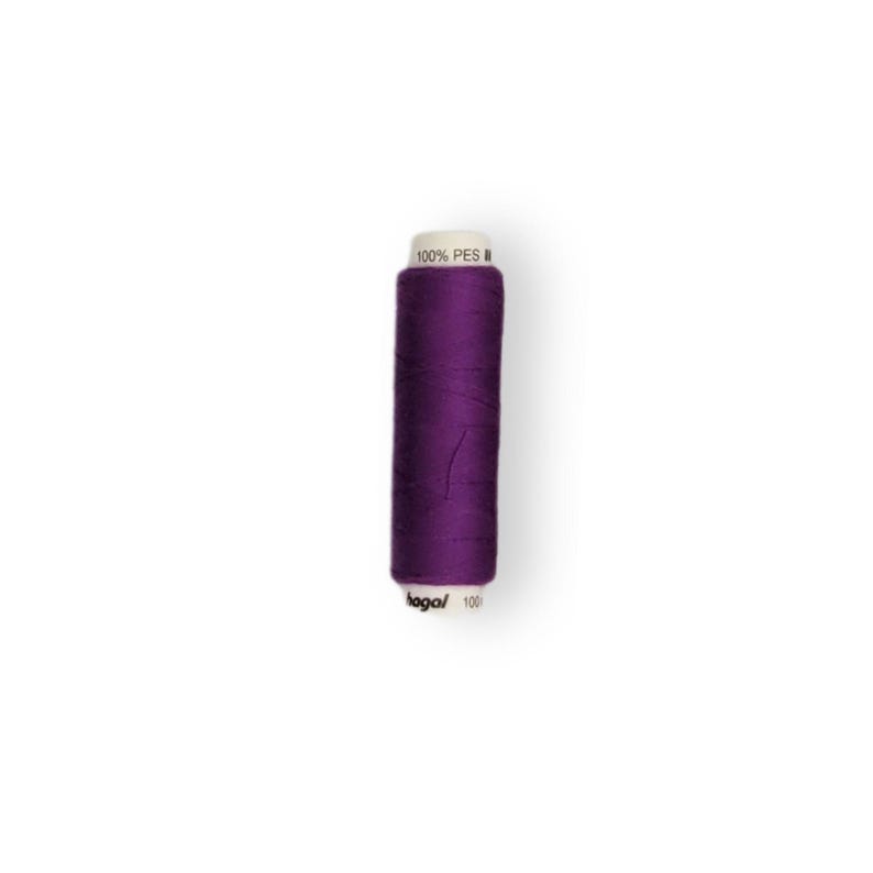 May include: A spool of purple thread labeled "100% PES" and "bago/100".