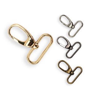 May include: Four metal swivel clasps in gold, silver, black, and antique brass finishes. Each clasp has a hook and a D-ring.
