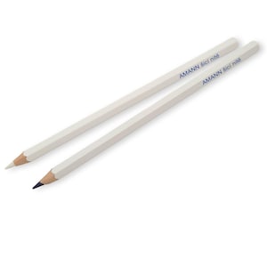 May include: Two white pencils with blue lettering that reads "AMANN Sic! nite"