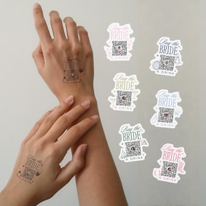May include: Temporary tattoos with the text "Buy the Bride A Drink" and a QR code. The tattoos are in black ink and applied to a person's wrist and forearm. Several sticker versions are also shown, with different colored backgrounds.