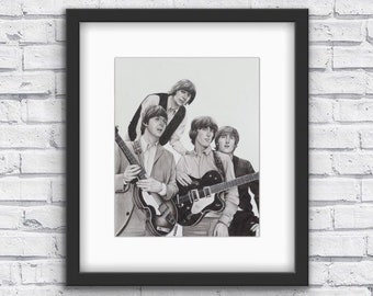 May include: Black and white drawing of four men in a band, holding guitars. The men are wearing suits and have their hair styled in the 1960s fashion.
