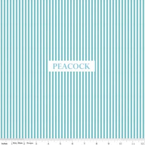 May include: A fabric with a vertical stripe pattern in light blue and white. The word "PEACOCK" is displayed in a white rectangle. The image includes an inch ruler along the bottom edge.