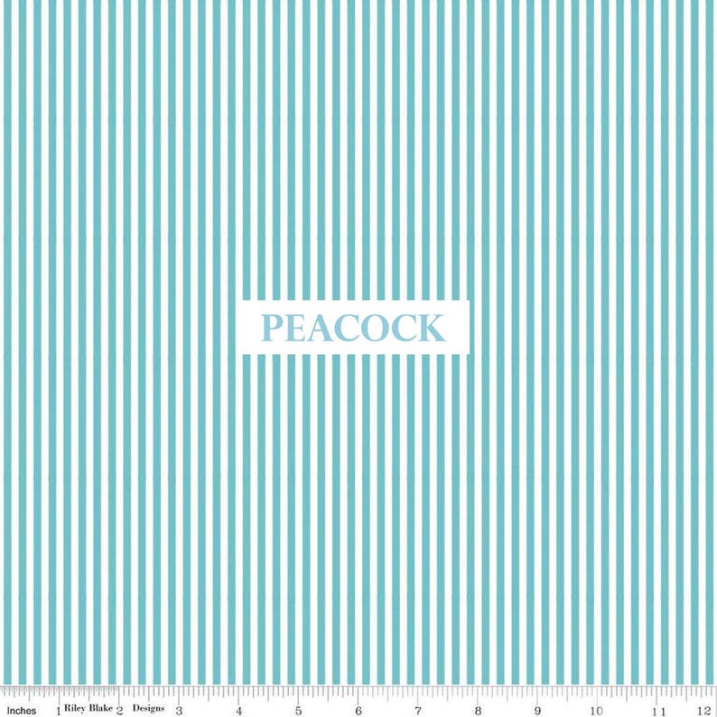 May include: A fabric with a vertical stripe pattern in light blue and white. The word "PEACOCK" is displayed in a white rectangle. The image includes an inch ruler along the bottom edge.