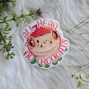 Sticker met kuifgekko en aardbeienhoedje | reptiel | grappig cadeau | glanzend vinyl | laptopsticker waterfles