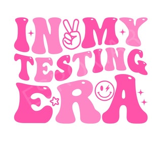 May include: Pink graphic with the text "In My Testing Era" in a retro font. The graphic includes a peace sign, a smiley face with a lightning bolt, and stars.