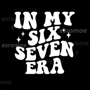 May include: Black background with the white text "IN MY SIX SEVEN ERA" in a retro font. The words are stacked, with starburst graphics between the words. The design is simple and bold.