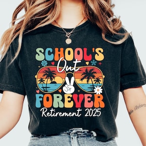 May include: A black t-shirt with a colorful graphic that says "School's Out Forever" with a peace sign and palm trees. The text "Retirement 2025" is below the graphic.