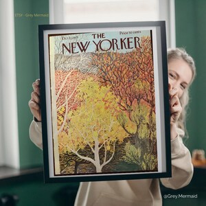 May include: Framed vintage New Yorker cover art featuring a colorful autumn landscape with trees in shades of yellow, orange, and brown. The cover is dated December 22, 1975, and the price is 50 cents. The artwork is displayed in a black frame.