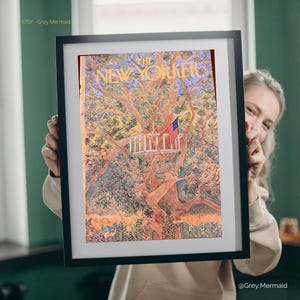 May include: Framed print of a New Yorker magazine cover featuring a treehouse scene with an American flag. The artwork has a warm color palette with shades of brown, green, and yellow. The print is held in a black frame.