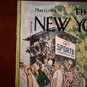 May include: The New Yorker magazine cover from May 13, 1974, featuring an illustration of a crowd watching a sporting event. The artwork depicts a broadcast booth with cameras and the word "SPORTS" on a sign.