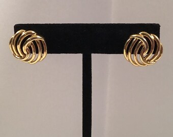 Monet round gold tone earrings.