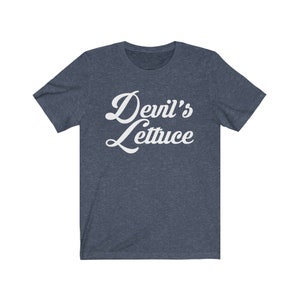 May include: A dark blue t-shirt with a white retro-style graphic that says "Devil's Lettuce".