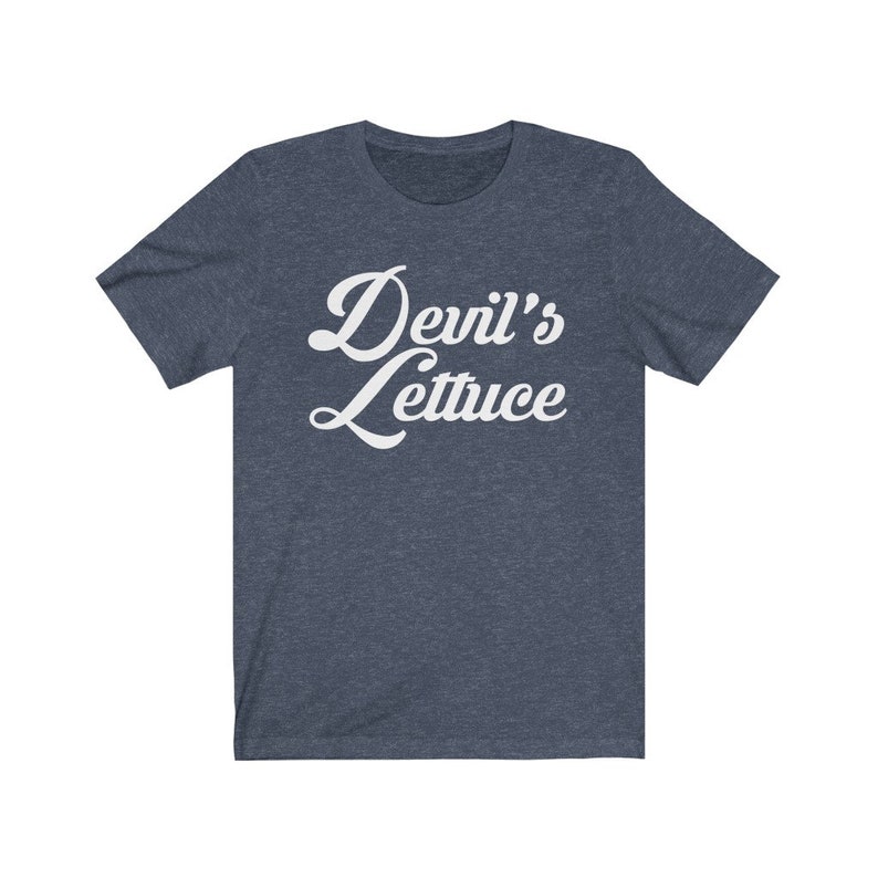 May include: A dark blue t-shirt with a white retro-style graphic that says "Devil's Lettuce".