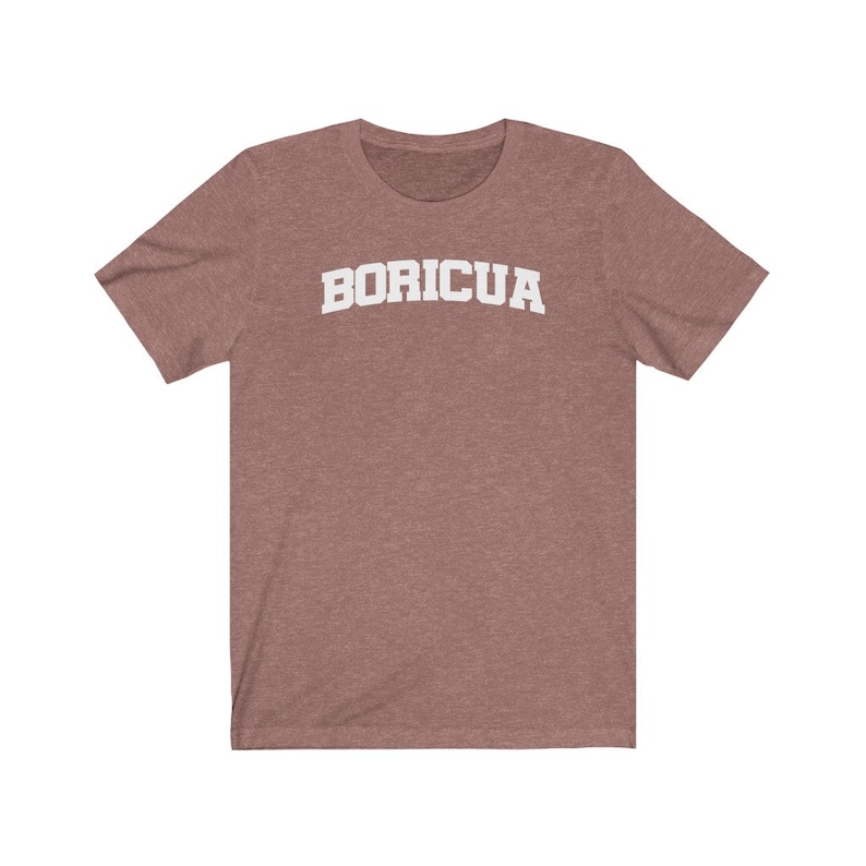 May include: A heather grey t-shirt with the word "BORICUA" printed in white on the front.