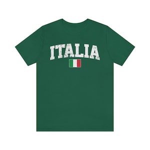 May include: A green t-shirt with the word "ITALIA" in white distressed lettering and a small Italian flag.