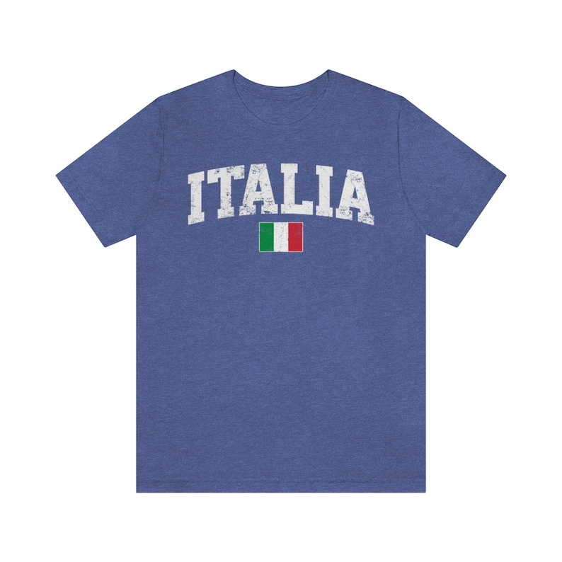 May include: A blue t-shirt with the word "ITALIA" in white distressed lettering and a small Italian flag.