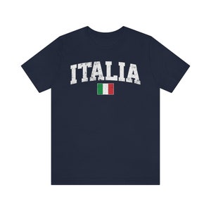 May include: A navy blue t-shirt with a white distressed graphic of the word "ITALIA" and the Italian flag.
