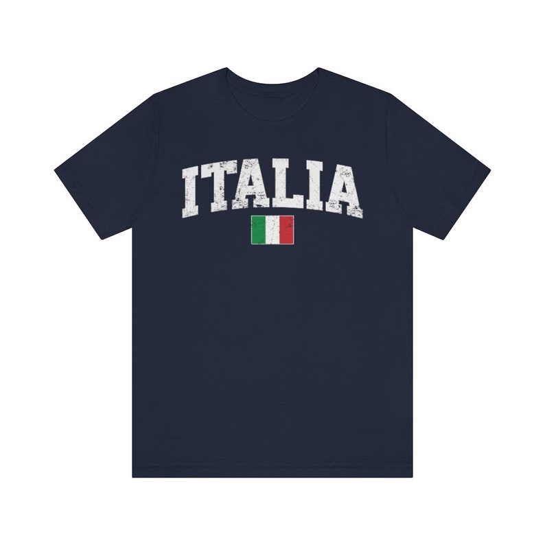 May include: A navy blue t-shirt with a white distressed graphic of the word "ITALIA" and the Italian flag.