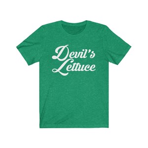 May include: A green t-shirt with the text "Devil's Lettuce" in white cursive lettering.