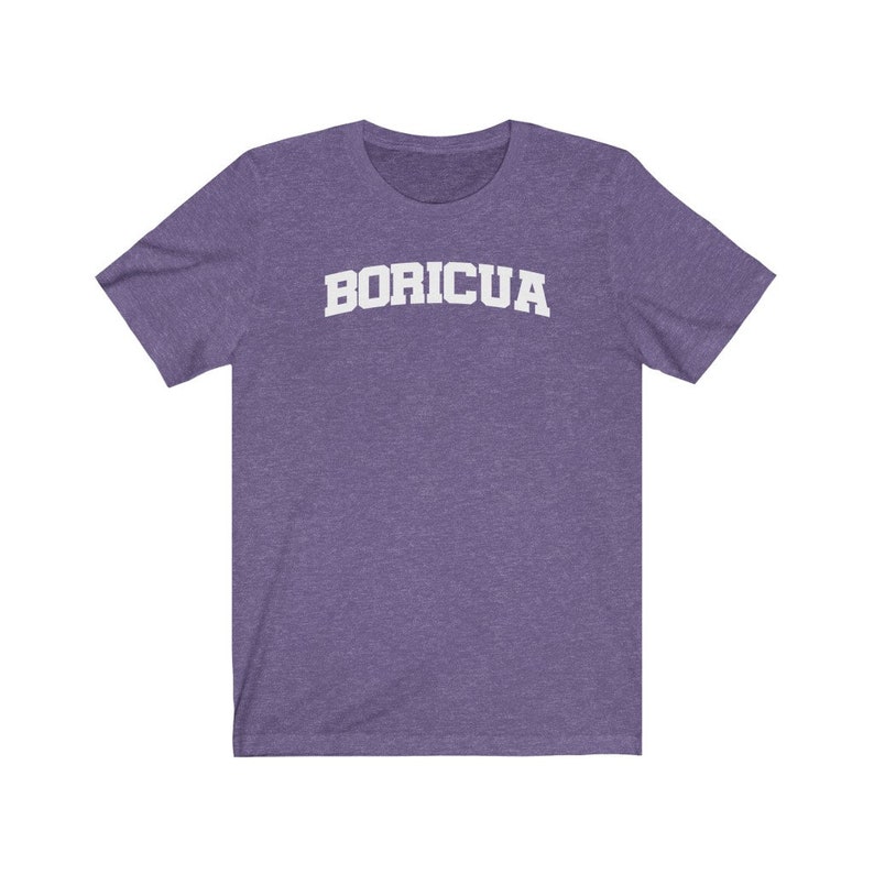 May include: Purple short-sleeved t-shirt with the word "BORICUA" printed in white on the front.