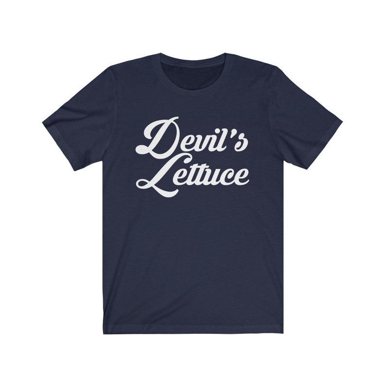 May include: A navy blue t-shirt with white text that reads "Devil's Lettuce" in a retro font.