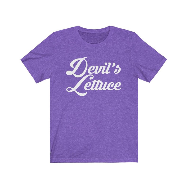 May include: Purple short-sleeved t-shirt with the text "Devil's Lettuce" in white cursive lettering.