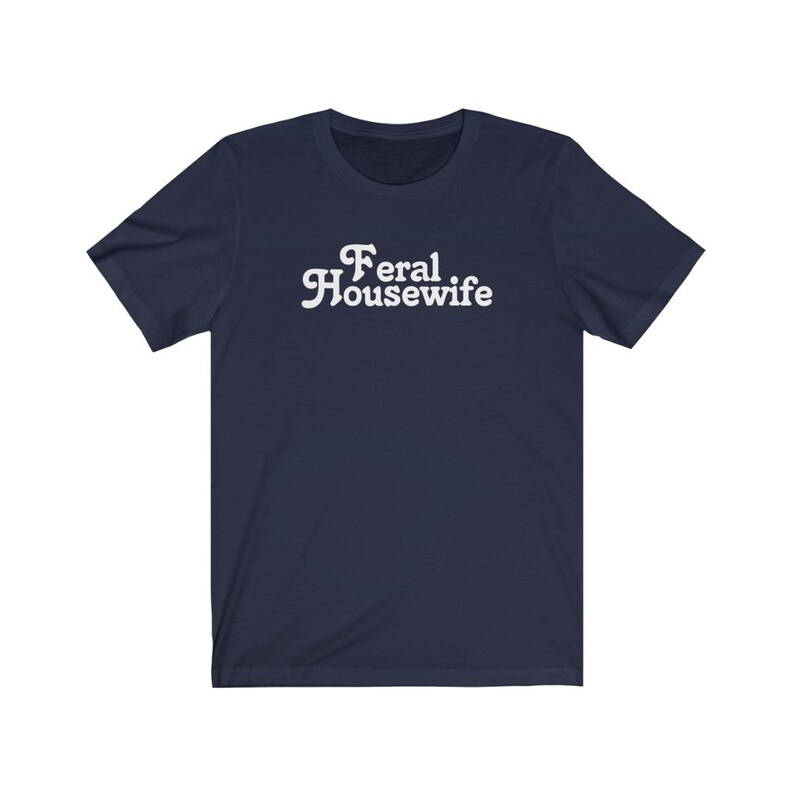May include: A navy blue t-shirt with white text that reads "Feral Housewife".
