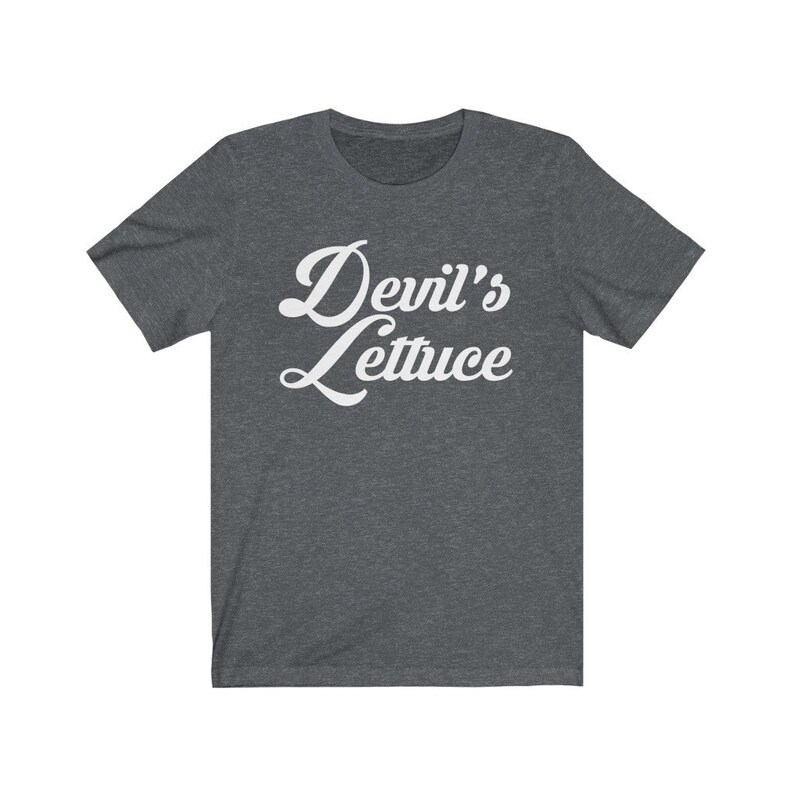 May include: A dark heather grey t-shirt with the text "Devil's Lettuce" in white cursive lettering.