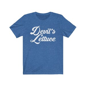 May include: A blue t-shirt with the text "Devil's Lettuce" in white cursive lettering.