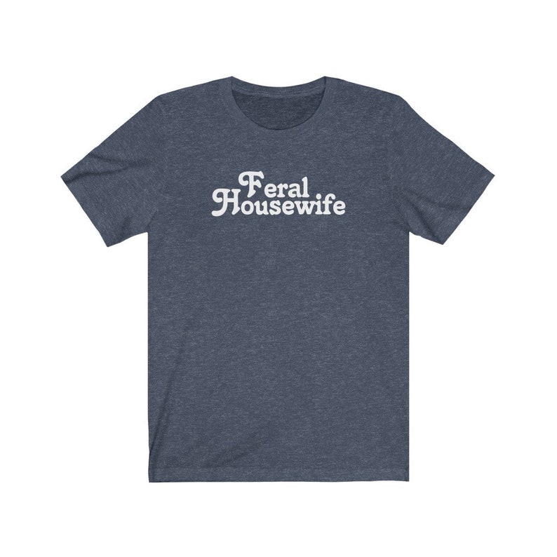 May include: A dark blue t-shirt with the text "Feral Housewife" in white.